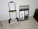 a small hand truck with a ladder next to it