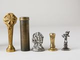 several different types of metal objects are displayed on a white surface