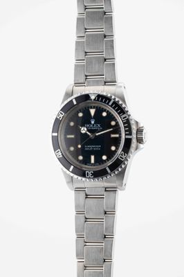 an image of a wrist watch with a black dial on a silver bracelet