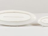 a white plate and a white bowl sitting on a table