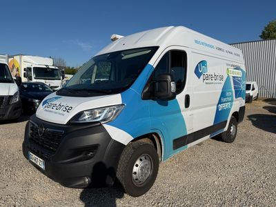 a white and blue van that is parked in a lot