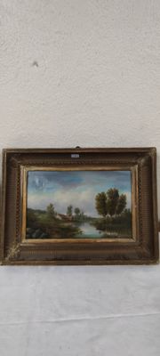 deux tableaux encadrés représentant un paysage accrochés à un mur blanc