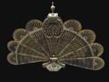 a gold fan that is on a black background