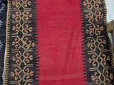 several different rugs on a table with tags on them