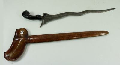 an old knife and a wooden handle on a white surface