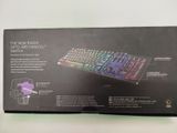 boxed box of a computer keyboard on a white surface