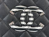 chanel logo on a black and white quilted purse