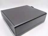 a close up of a small black computer on a white surface