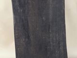sculpture of a rectangle shaped piece of wood on a black base