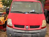 une camionnette rouge garée à côté d'un arbre