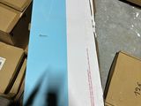 a large box of boxes on the floor next to a pile of boxes