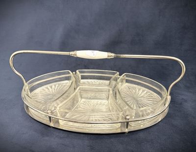 an image of a glass tray with a handle on a black background