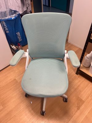 an image of a blue office chair in a room with a wooden floor