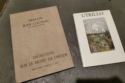 two books sitting on a table next to each other