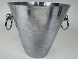 a large silver metal vase with two handles on it
