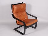 a brown leather chair with a black frame and black legs