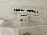 the back of a pair of white pants with an amazon essentials label on it