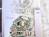 a book with a map of a city and a picture of a man