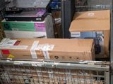 many boxes in a metal cage on the floor