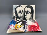 an open book with a picture of two people on it