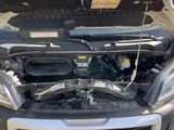 an image of a car with its hood open and the hood up