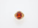 an orange sapphire and diamond ring