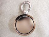 a picture of a pocket watch on a white cloth