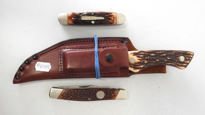 three different types of knives on a white surface