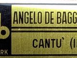 a gold and black label on a black and white label