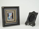 a black picture frame with a picture of a woman and a picture of a man