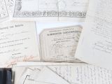 a pile of old papers that are on a table