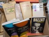 boxes of books are stacked on top of each other on a table