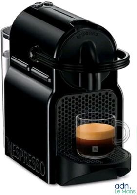 a close up of a coffee machine with a cup of coffee