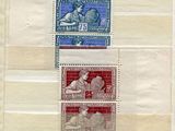 quatre timbres différents sur une feuille de papier représentant un homme et une femme