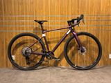 the bike is parked against the wall in the garage
