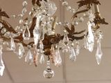 a chandelier hanging from the ceiling in a room