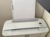 a printer that is sitting on top of a shelf