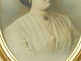 portrait of a woman in a white dress and a hat