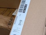 a cardboard box with a sticker on top of it