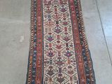 an old rug on the floor is laying on the floor