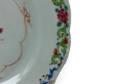 a white plate with a floral design on it