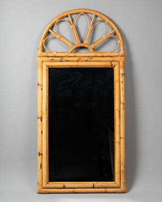 an image of a bamboo framed mirror with a sunburst design