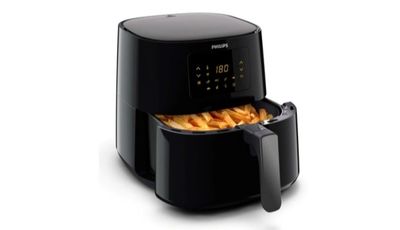 gros plan d'une friteuse avec des frites dedans