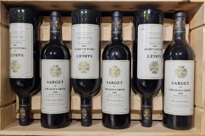 six bottles of wine in a wooden box