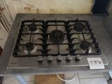 a stove top with a lot of burners on it
