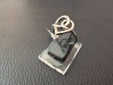 a cell phone that is sitting on top of a piece of metal