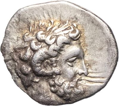 a silver coin with a head of a man on it