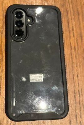 two cell phones sitting on a table next to each other