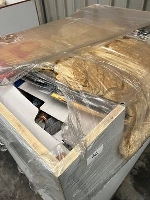 a box with some food inside of it that is wrapped in plastic