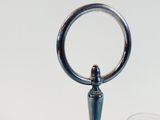 a silver object with a ring on top of it